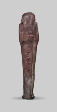 Ushabti, A shabti figurine dressed in a shroud stands on a base. On the head is a smooth wig