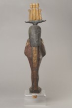 Osiris, Osiris mythology. Figurine in the form of a human mummy wearing a hemhem crown with ram's