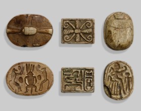 Scarab with a silhouette of a ruler on a throne. The scarab’s base shows a royal figure seated on a