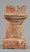 Horned altar serving as a censer, ceremonial vessel/altar. Square base, cylindrical shaft with