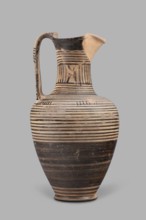 Oinochoe, Geometric oinochoe with a low foot, a gradually widening belly, distinct shoulders, a
