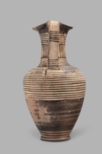Oinochoe, Geometric oinochoe with a low foot, a gradually widening belly, distinct shoulders, a