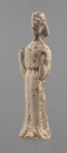 Terracotta figurine of a woman, unknown Boeotian workshop. Female mold-pressed terracotta figurine.