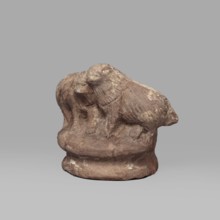Two dogs, Two dogs shown schematically on a round, profiled base. The dogs are shown standing, with