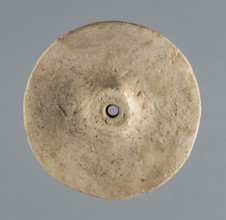 Wheel from a model wagon, unknown northern Mesopotamian workshop, terracotta model wheel with a