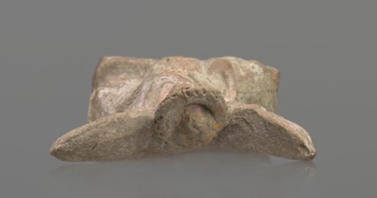 Terracotta figurine of Eros with a goose. Figurine of a standing Eros: the figure, positioned