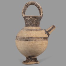 Jug on a ring-shaped foot, from which a low, wide stem extends, transitioning into a belly. The