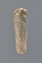 Ushabti - fragment. Mummy-shaped figurine fragment of the legs preserved from hips to ankles; the