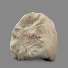 Head of a woman wearing a veil. The face is oval with regular features: rounded chin, small compact