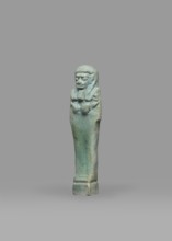 Ushabti, Mummy-shaped funerary figurine shabti, standing on a base, back supported by a