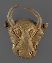 Protoma bull head relief mask, A bull's head in the form of a relief mask made using the repoussé