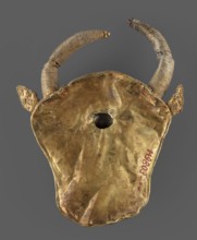 Protoma; bull's head relief mask in gold, made using repoussé with granulation and filigree.