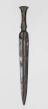 Dagger, unknown Luristan workshop. A dagger with a blade cast together with a mushroom-shaped hilt,