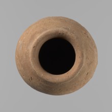 Vessel with hieratic inscription. Hand-made clay vessel, turned in the upper part neck, spout.
