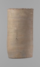 Canopic urn. Clay canopic urn with a cylindrical shape and a flat bottom and a flat, straight rim.