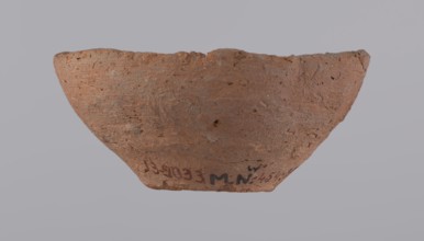 Bowl, probably votive, conical shape with a flat bottom. Straight rim, slightly curled toward the