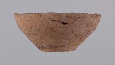 Bowl, probably votive, with a conical shape and a flat bottom. Straight rim, slightly curled
