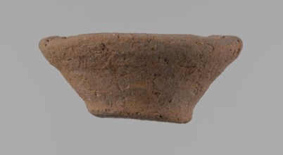Bowl, probably votive, conical shape with flat bottom. Irregular walls; straight, slightly flaring