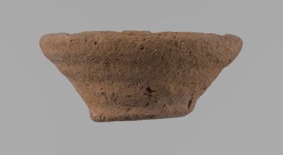 Bowl, probably votive, conical shape with a flat bottom. Irregular walls; straight rim slightly