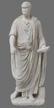 Roman statue, unknown Roman workshop. The figure of a standing man dressed in a tunic and toga,