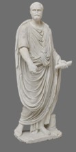 Roman statue, unknown Roman workshop. The figure of a standing man dressed in a tunic and toga,