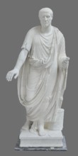 Roman statue, unknown Roman workshop. Figure of a striding man dressed in a tunic and toga. The