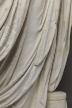 Roman statue, unknown Roman workshop. Figure of a striding man dressed in a tunic and toga. The