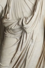 Roman statue, unknown Roman workshop. Figure of a striding man dressed in a tunic and toga. The