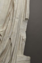 Roman statue, unknown Roman workshop. Figure of a striding man dressed in a tunic and toga. The