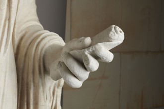 Roman statue, unknown Roman workshop. Figure of a striding man dressed in a tunic and toga. The