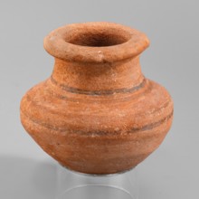 Vessel, A small wheel-made clay vessel with an almost hemispherical belly that transitions halfway