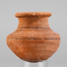 Vessel. A small wheel-made clay vessel with an almost hemispherical belly that transforms halfway