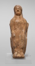 Figurine of a seated woman. Figurine of a woman sitting on a throne with her hands placed on her