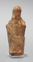 Figurine of a seated woman. Figurine of a woman sitting on a throne with her hands placed on her