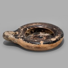 Oil lamp, Reddish, fine-grained clay. Low lamp with broad arms slightly curled inward. Large oil