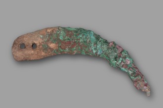 Sickle blade, unknown Northern Mesopotamian workshop. The sickle blade is arched, tipped with a