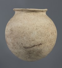 Spherical clay vessel, vice-less, from an unknown Northern Mesopotamian workshop, Early Jazira III