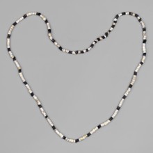 Necklace composed of 268 small beads cylindrical and discoid in white and black stringing and