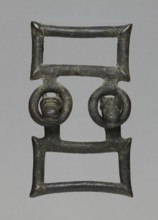Buckle, bronze; two-part rectangular form with joints; one part with hooks shaped as zoomorphic