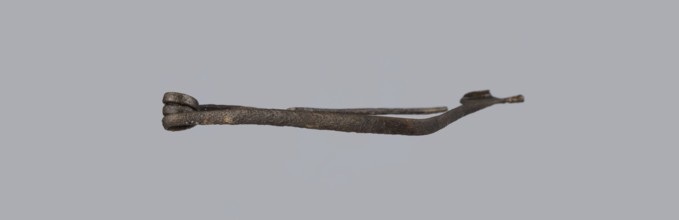 Fibula, bronze Etruscan fibula with a bent ring made of flatly beaten wire, passing in a three-turn