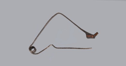 Bronze Etruscan fibula with a bent ring made of flatly beaten wire, passing in a three-turn spiral