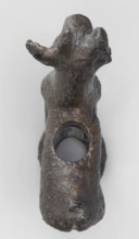 Emblem in the form of a figurine of a standing goat figurine of a standing gazelle with slightly