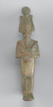 Figurine of Osiris depicted as a mummy-like standing figure wrapped in a shroud. The arms