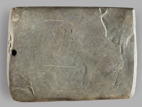 Rectangular paddle with a hole at one of the shorter edges; possibly a whetstone. Flat rectangular