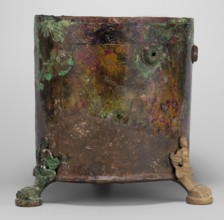 Cista container decorated with a depiction of the Dioscuri and Athena. Cylindrical vessel made of