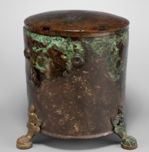 Cista container decorated with a depiction of the Dioscuri and Athena. Cylindrical vessel made of