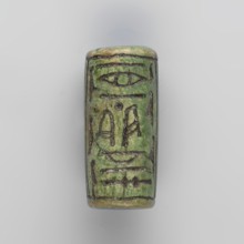 Cylinder seal with pseudo-hieroglyphs, A cylindrical seal with a hole drilled along the cylinder.