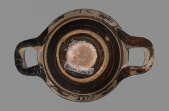 Miniature skyphos. Reddish clay, black-brown firnis poorly covering the outside on the foot, at the