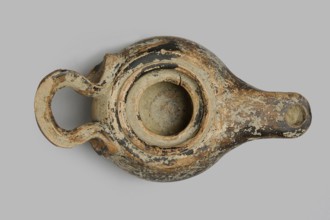 Oil lamp, unknown Attic workshop. Wheel-made lamp with a globular, slightly squat container.