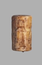 Cylinder seal with a presentation scene and a cuneiform inscription, unknown Akkadian workshop;